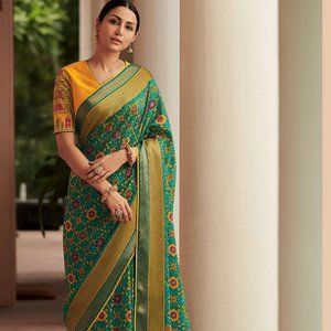 TRENDY TEAL GREEN FLORAL DESIGNED SOFT SILK SAREE WITH BEAUTIFUL TASSELS